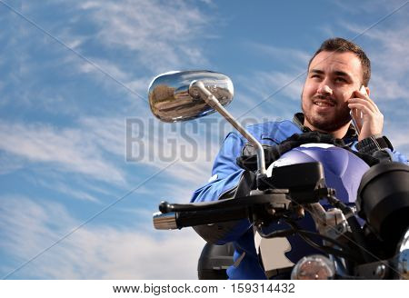 Biker Talking By Phone With His Smarth Phone
