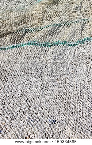Many fishing nets stretched in a port