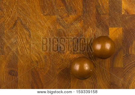 pair of copper Chinese singing balls Baoding of health for hands on wooden background