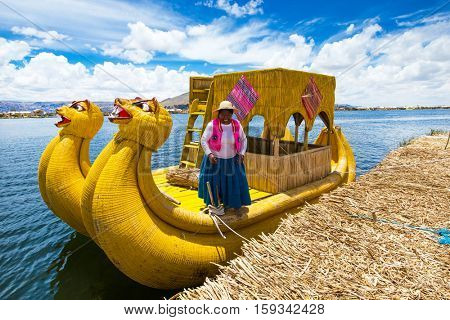 PERU - MAY 11, 2015: Unidentified women in traditional dresses welcome tourists in Uros Island