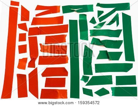 Collection of green and red electrical tape pieces