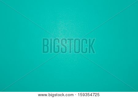 Macro of a turquoise colored wall texture background