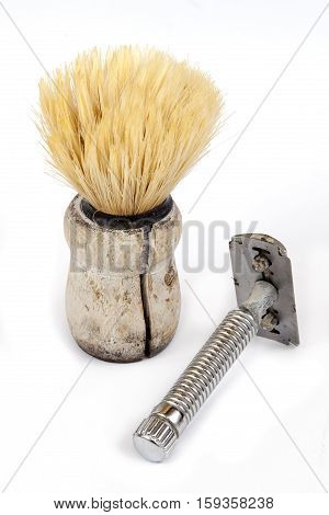 old and dirty shaving materials on white background
