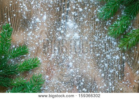 Christmas Tree Green Branches On Winter Snowflakes Wooden Space Background