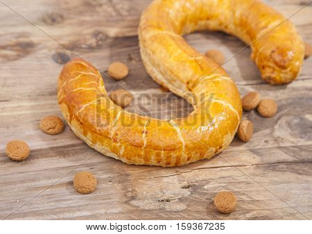 Traditional Dutch cookie Banketletter at Sinterklaas celebration on wooden background