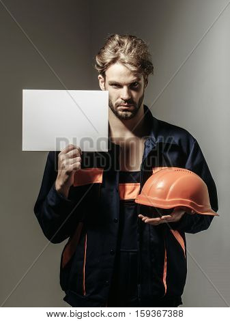Serious Man Keeps Hard Hat