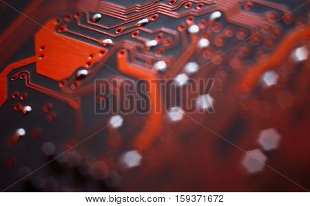 Bokeh electronic circuit close up computer in red colors