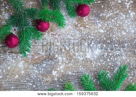 Christmas Tree Green Branches, Red Balls, Winter Snowbound Wooden Background