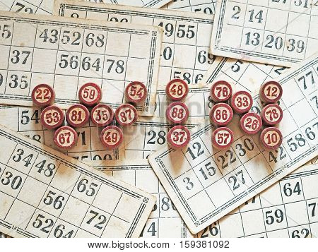 Tabletop old lotto game with wooden elements. Cards bingo. Keywords win