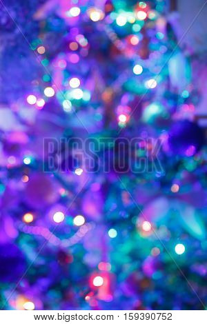 Christmas background blur Christmas tree with toys glow in the dark closeup