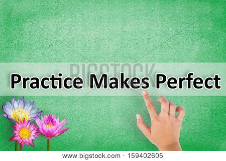 pointing hand Practice Makes Perfect message on the wall background