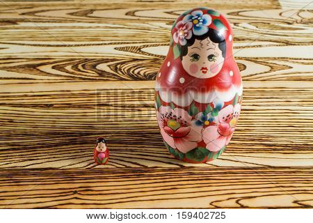 Russian dolls on a wooden table. Matrioshka.