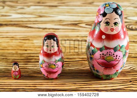 Russian dolls on a wooden table. Matrioshka.