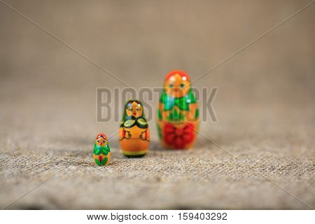 Russian dolls. Matryoshka on linen fabric for the background.