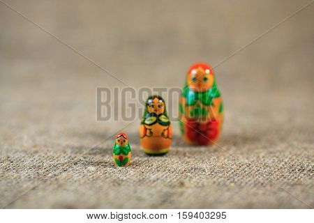 Russian dolls. Matryoshka on linen fabric for the background.