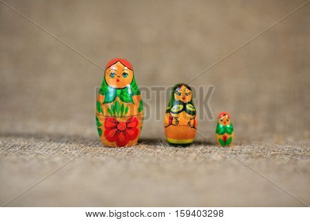 Russian dolls. Matryoshka on linen fabric for the background.