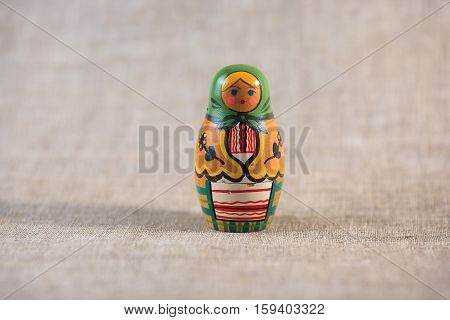Russian dolls. Matryoshka on linen fabric for the background.