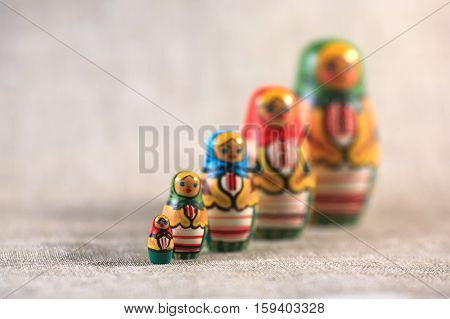 Russian dolls. Matryoshka on linen fabric for the background.