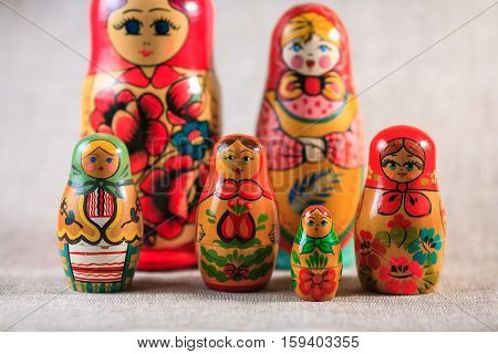 Russian dolls. Matryoshka on linen fabric for the background.
