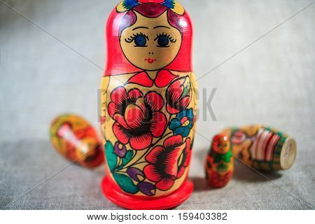 Russian dolls. Matryoshka on linen fabric for the background.