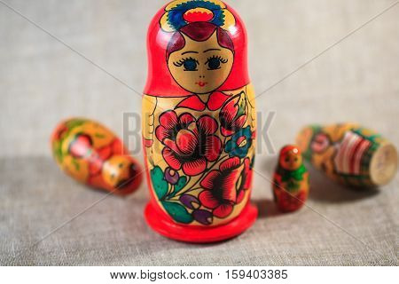 Russian dolls. Matryoshka on linen fabric for the background.