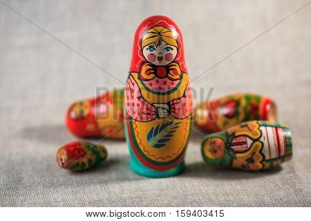 Russian dolls. Matryoshka on linen fabric for the background.