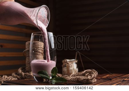Strawberry Smoothies On Vintage Wooden Table