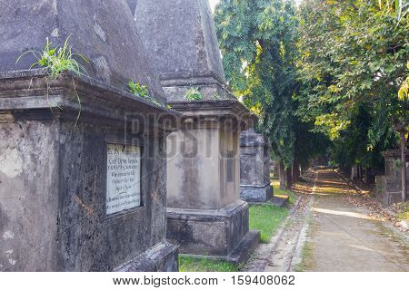 KOLKATA WEST BENGAL INDIA - NOVEMBER 2ND 2014 : Old cemetery at south Park Street Kolkata. It is one of the earliest non-church cemetaries in the world heritage site of Kolkata earlier Calcutta