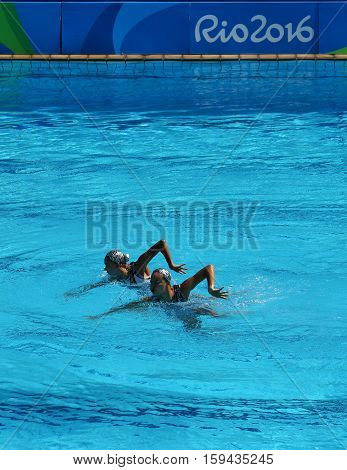RIO DE JANEIRO, BRAZIL - AUGUST 15, 2016: Huang Xuechen and Sun Wenyan of team China compete during synchronized swimming duets free routine preliminary of the Rio 2016 Olympic Games