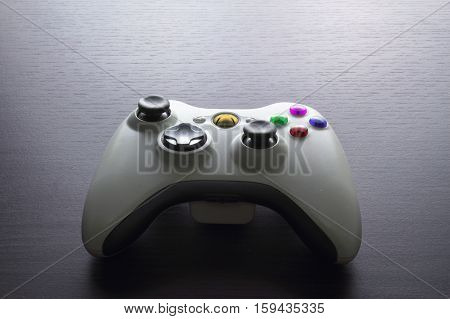 Game Joystick on a Rustic Wooden Background