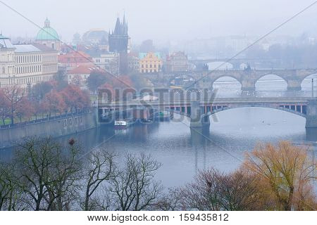 Panorama of an old Prague, bridges and embankment of Vitava river, Czechia