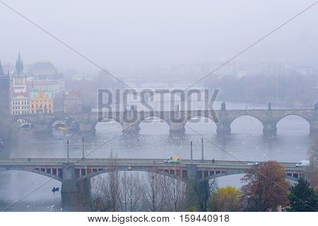 Panorama of an old Prague, bridges and embankment of Vitava river, Czechia