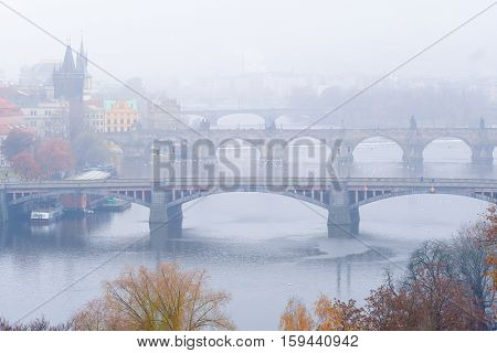 Panorama of an old Prague, bridges and embankment of Vitava river, Czechia
