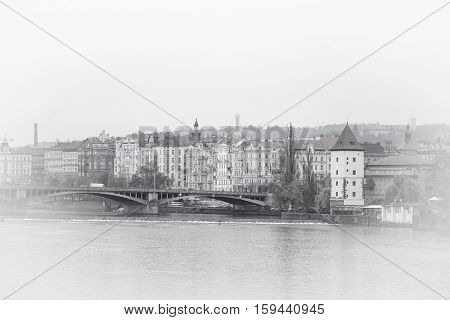 Panorama of an old Prague, bridges and embankment of Vitava river, Czechia