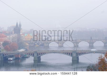Panorama of an old Prague, bridges and embankment of Vitava river, Czechia