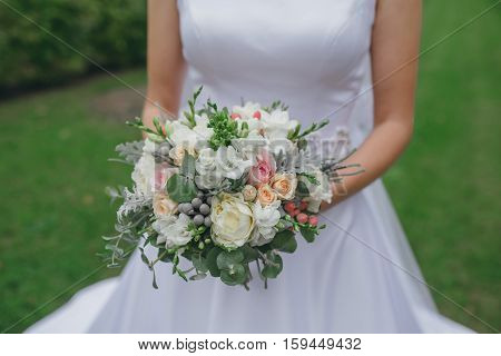 bridal bouquet in hands of the bride
