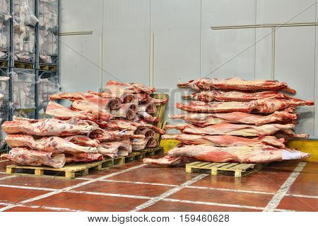 frozen stocks of red meat in a cold warehouse