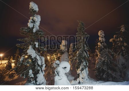 Beautiful cold mountain view of ski resort, winter day with slope, piste and ski lift, evening twilight night picture