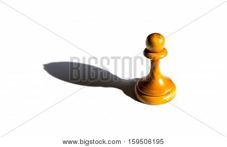 a chess pawn casting a bishop piece shadow concept of strength and aspirations