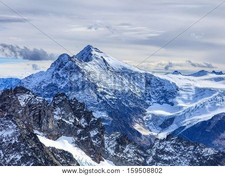 View from Mt. Titlis in the Swiss Alps. Mount Titlis is a mountain, located on the border between the Swiss Cantons of Obwalden and Bern.