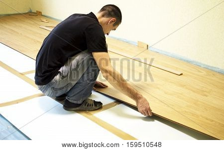 The Process Of Installing Laminate Wooden On The Floor