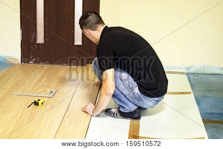 The Process Of Installing Laminate Wooden On The Floor