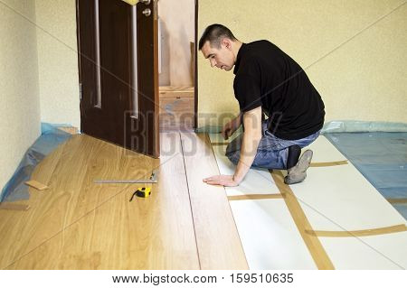 The Process Of Installing Laminate Wooden On The Floor