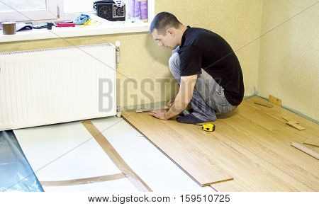 The Process Of Installing Laminate Wooden On The Floor
