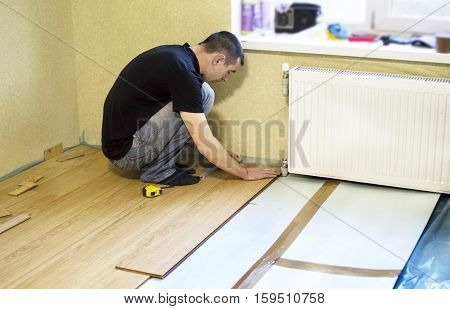 The Process Of Installing Laminate Wooden On The Floor