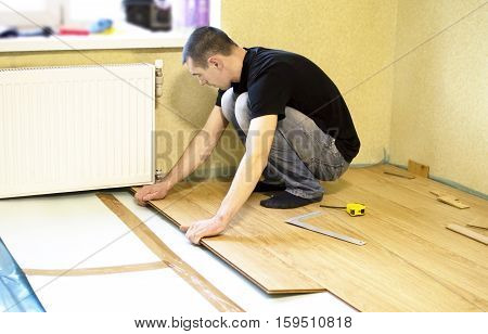 The Process Of Installing Laminate Wooden On The Floor