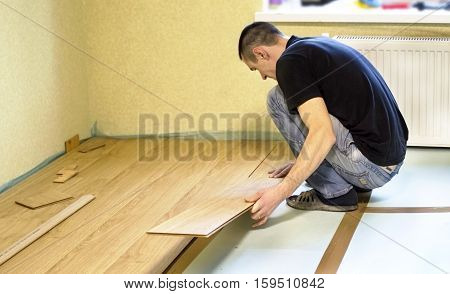The Process Of Installing Laminate Wooden On The Floor