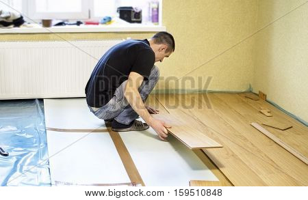 The Process Of Installing Laminate Wooden On The Floor