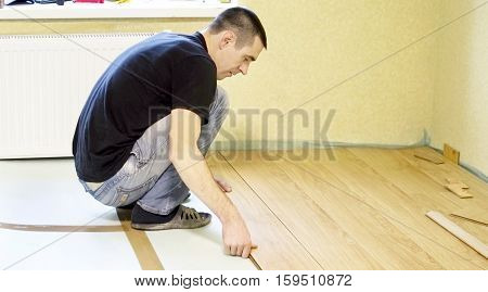 The Process Of Installing Laminate Wooden On The Floor