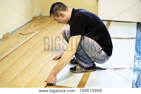 The Process Of Installing Laminate Wooden On The Floor
